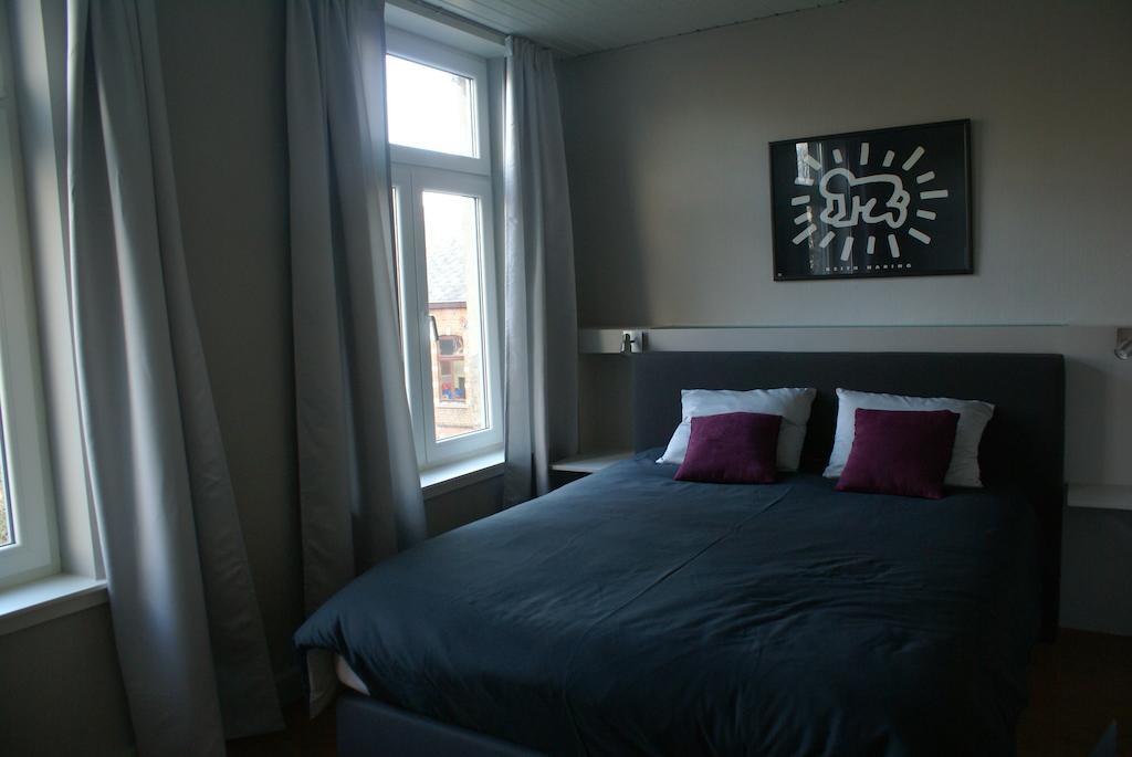 Guest House Feliz Lovaina Habitación foto